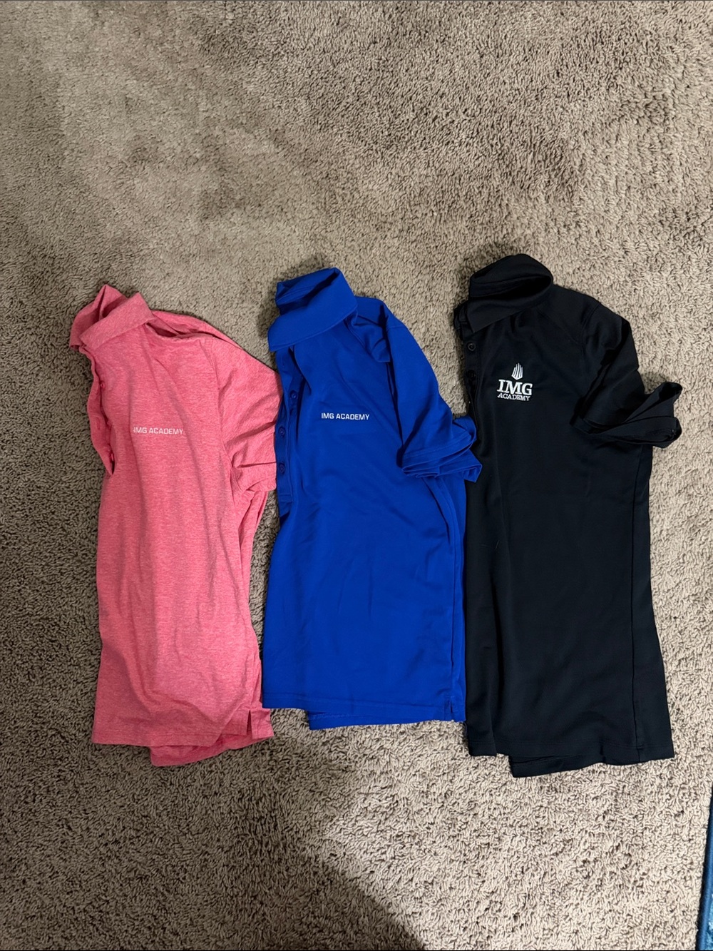 IMG Academy Under Armour Girls' Polo Trio in Pink, Blue, and Black size small